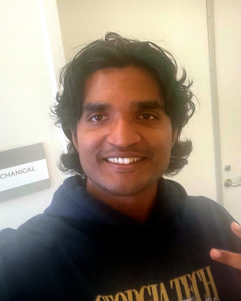 Terren Jeyakumar smiling in a Georgia Tech hoodie